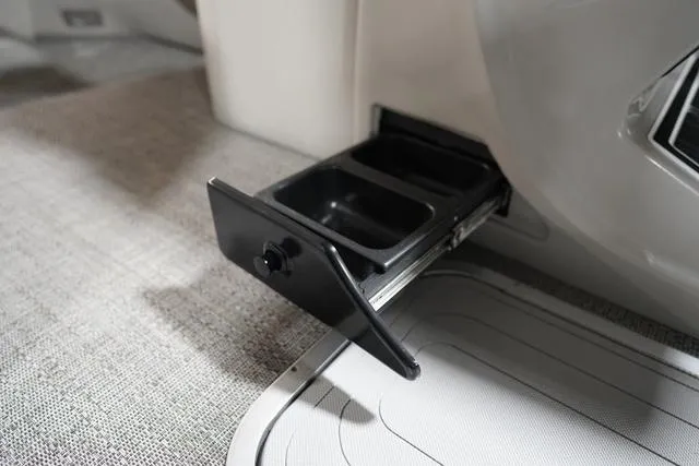 Slide: The Image of 2025 Barletta Corsa 23UC boat interior with pull-out storage compartment. - 35