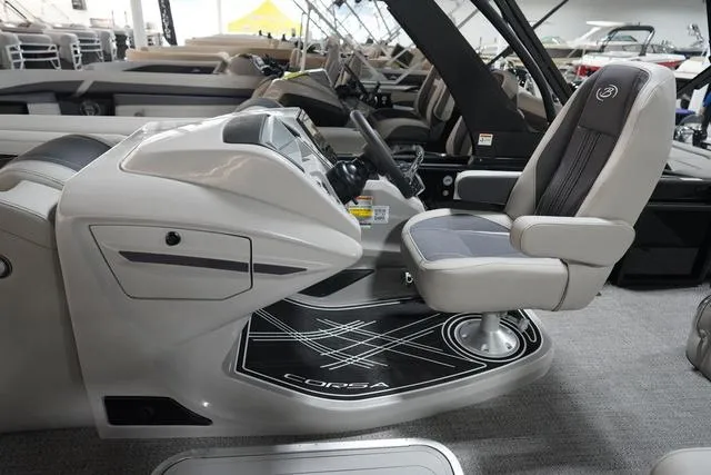 Slide: The Image of 2025 Barletta Corsa 23UC boat interior with sleek helm and comfortable captain's chair. - 38