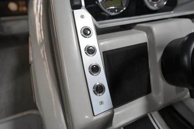 Slide: The Image of Control panel of 2025 Barletta Boats Corsa 23UC with sleek design and modern buttons. - 42