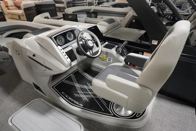 Slide: The Image of 2025 Barletta Corsa 23UC boat interior with modern helm and comfortable seating. - 46