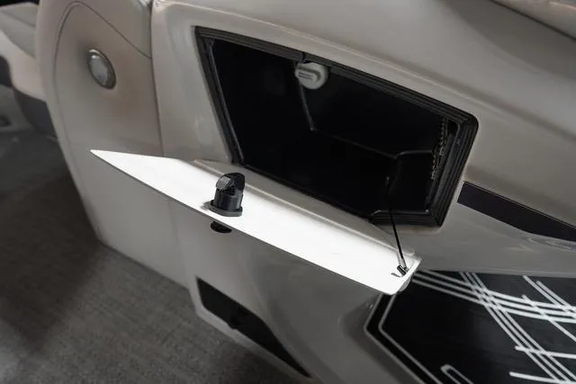 Slide: The Image of 2025 Barletta Corsa 23UC boat storage compartment with open hatch and sleek design. - 6