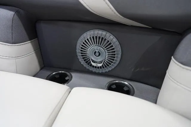 Slide: The Image of 2025 Barletta Boats C22QC interior with cup holders and fan vent detail. - 16