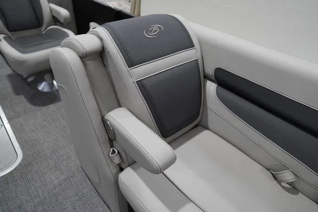 Slide: The Image of 2025 Barletta Boats C22QC interior seating with gray upholstery and logo detail. - 17