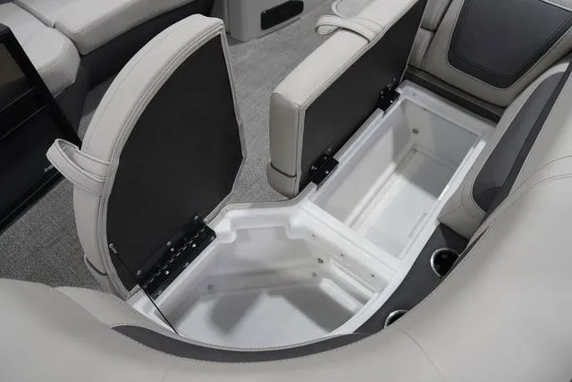 Slide: The Image of 2025 Barletta Boats C22QC interior storage compartments with open seats, showcasing spacious design. - 23