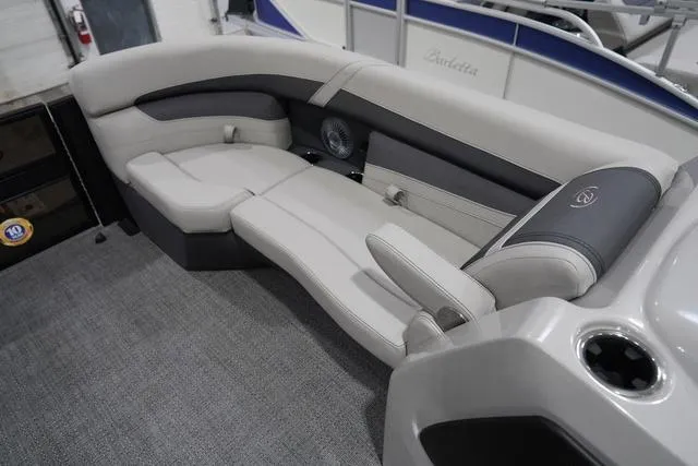 Slide: The Image of 2025 Barletta Boats C22QC interior with plush seating and modern design. - 26