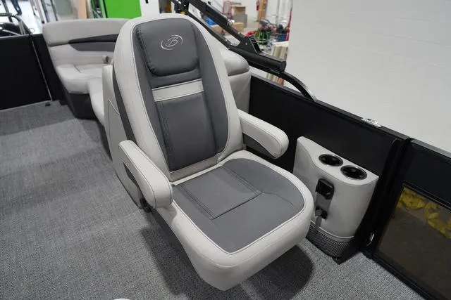 Slide: The Image of Captain's chair in 2025 Barletta Boats C22QC, featuring gray upholstery and cup holders. - 27