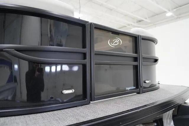 Slide: The Image of 2025 Barletta Boats C22QC pontoon, sleek black exterior, modern design. - 3