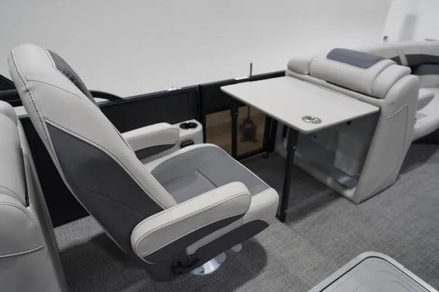 Slide: The Image of Luxury seating and table setup on 2025 Barletta Boats C22QC model. - 30