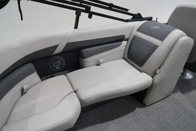 Slide: The Image of 2025 Barletta Boats C22QC interior seating with gray upholstery and integrated speaker system. - 34