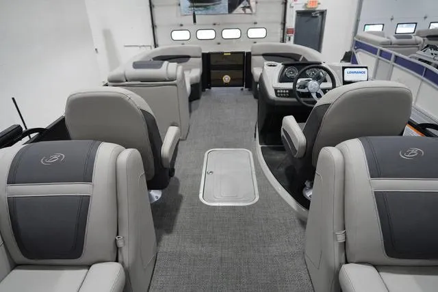 Slide: The Image of 2025 Barletta Boats C22QC interior with luxurious seating and modern dashboard design. - 35