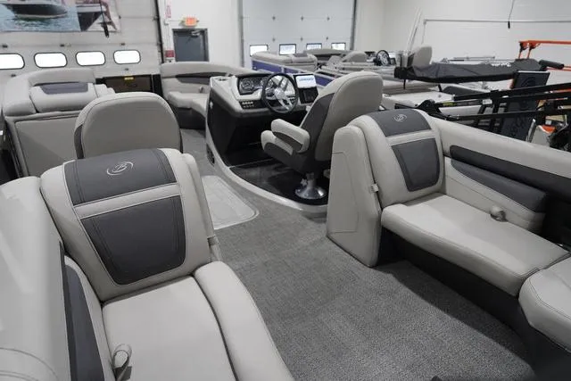 Slide: The Image of Interior of 2025 Barletta Boats C22QC, featuring luxurious seating and modern dashboard controls. - 37