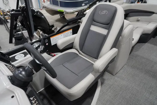 Slide: The Image of 2025 Barletta Boats C22QC captain's chair, featuring luxurious gray and white upholstery. - 9
