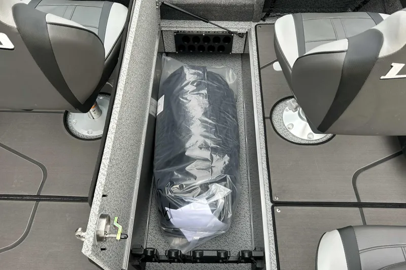 Slide: The Image of 2026 Lund 1975 Tyee boat interior with storage compartment and seating. - 14