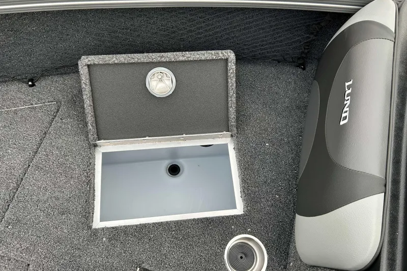 Slide: The Image of Interior of 2026 Lund 1975 Tyee boat showing storage compartment and seating. - 16