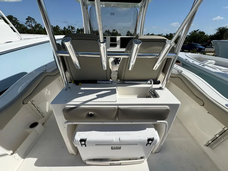 Slide: The Image of 2024 Key West 263 FS boat interior with seating and storage. - 12