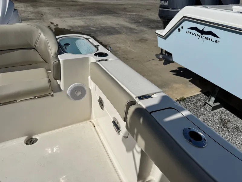 Slide: The Image of 2024 Key West 263 FS boat interior with seating and storage compartments. - 13
