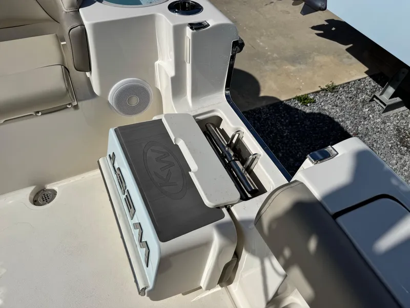 Slide: The Image of 2024 Key West 263 FS boat interior with seating and storage compartments. - 14