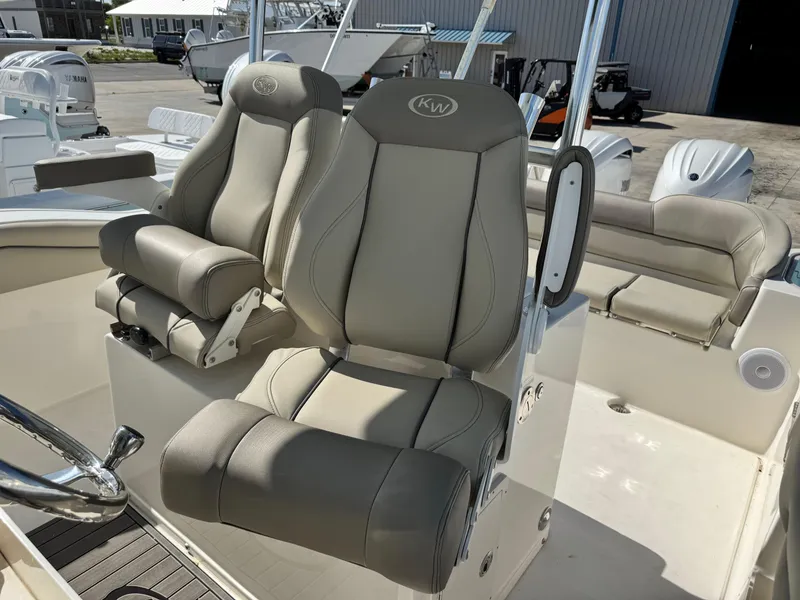 Slide: The Image of 2024 Key West 263 FS boat seats, featuring premium beige upholstery and ergonomic design. - 18