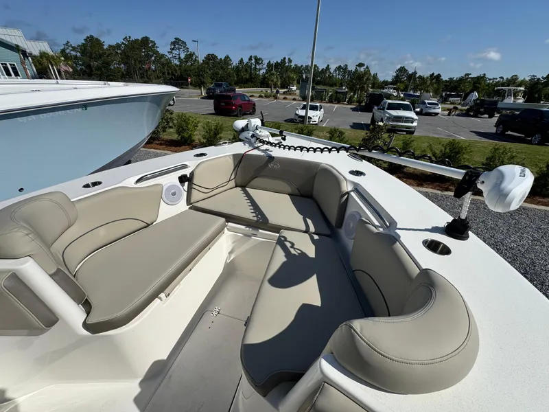 Slide: The Image of 2024 Key West 263 FS boat interior with beige seating and modern design. - 28
