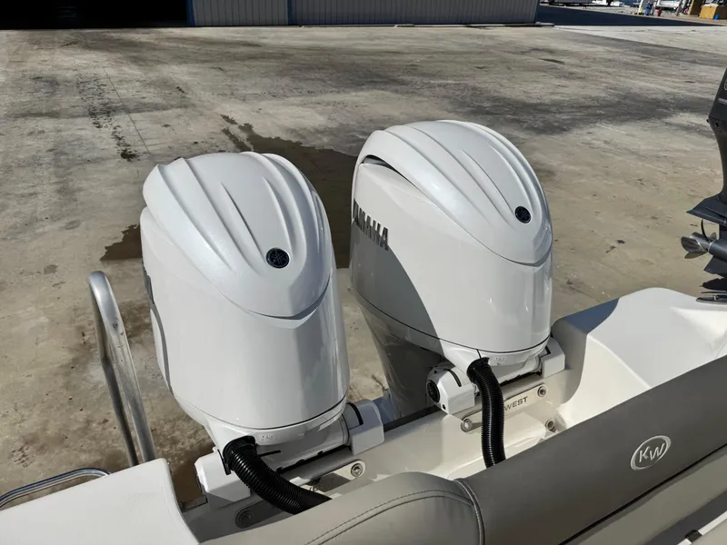 Slide: The Image of 2024 Key West 263 FS boat with dual Yamaha outboard engines. - 9