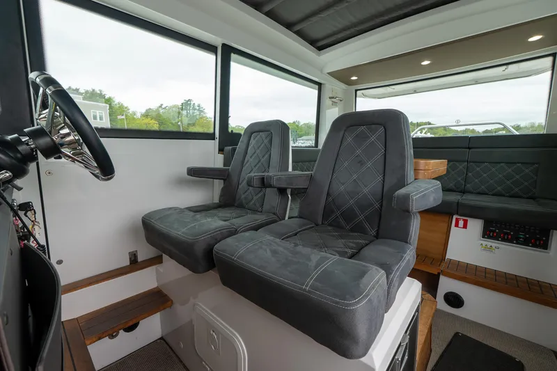 Slide: The Image of Interior of 2019 Axopar 37 Cabin with plush seating and modern design. - 17