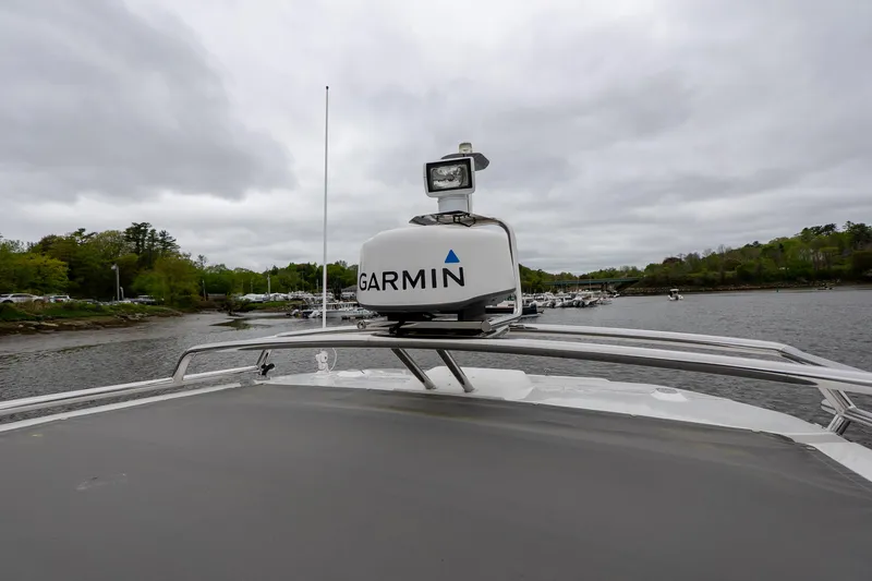 Slide: The Image of 2019 Axopar 37 Cabin boat with Garmin radar on a cloudy day. - 2