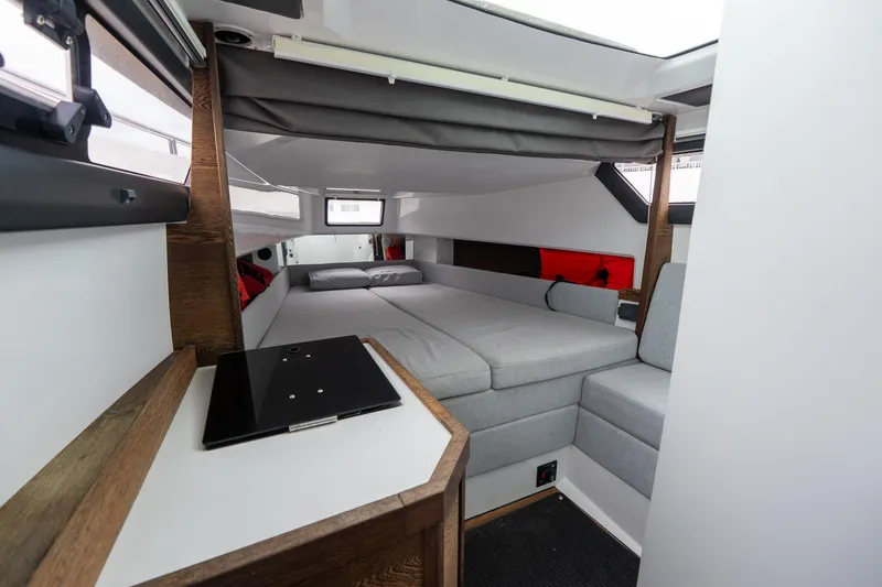 Slide: The Image of 2019 Axopar 37 Cabin interior with modern design and comfortable seating. - 25