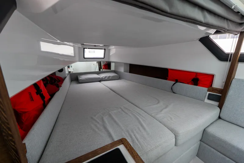 Slide: The Image of 2019 Axopar 37 Cabin interior with spacious bed and modern design. - 26