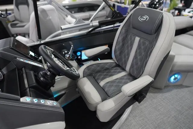Slide: The Image of 2025 Barletta Boats L23M cockpit with luxurious seating and modern controls. - 11