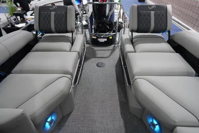 Slide: The Image of 2025 Barletta L23M boat interior with luxurious gray seating and blue LED lighting. - 14