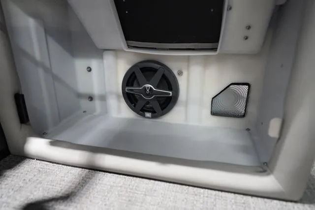 Slide: The Image of 2025 Barletta L23M boat interior storage with speaker and vent. - 15