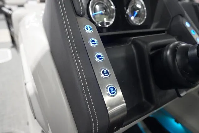 Slide: The Image of Dashboard controls of 2025 Barletta Boats L23M with illuminated buttons and gauges. - 17