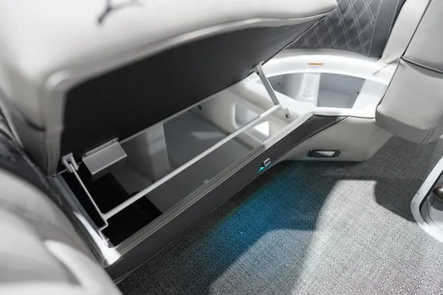 Slide: The Image of 2025 Barletta L23M boat interior storage compartment with open seat and modern design. - 25