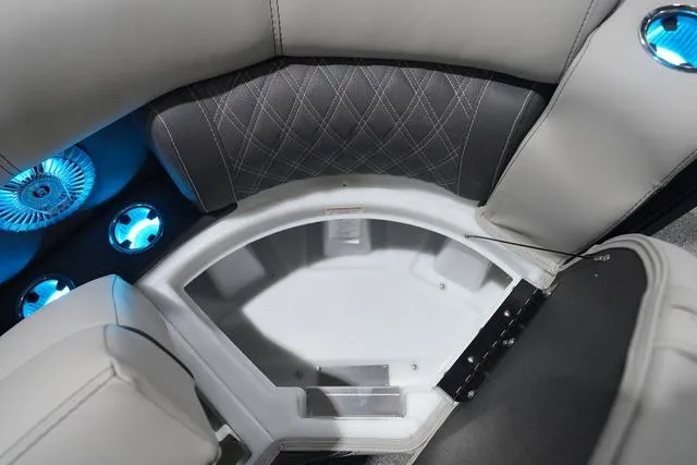 Slide: The Image of Luxurious seating area with blue LED lights on 2025 Barletta Boats L23M. - 26