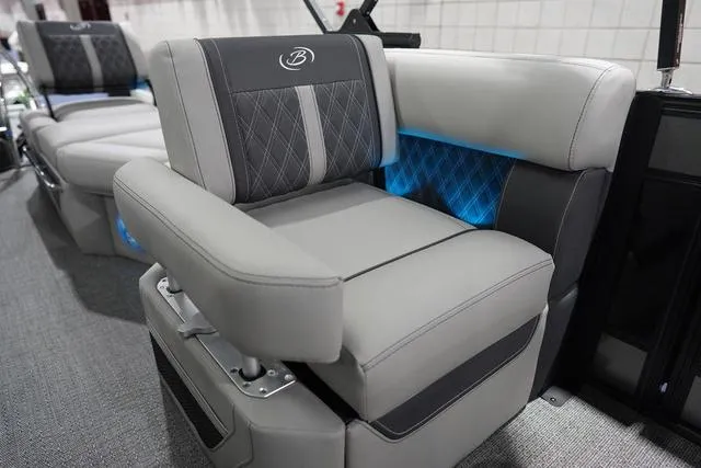 Slide: The Image of Luxurious seating on 2025 Barletta Boats L23M with elegant design and blue accent lighting. - 27