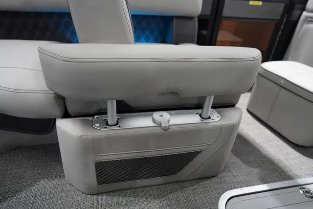 Slide: The Image of Barletta Boats L23M 2025 model interior seating with adjustable armrest and storage compartment. - 28