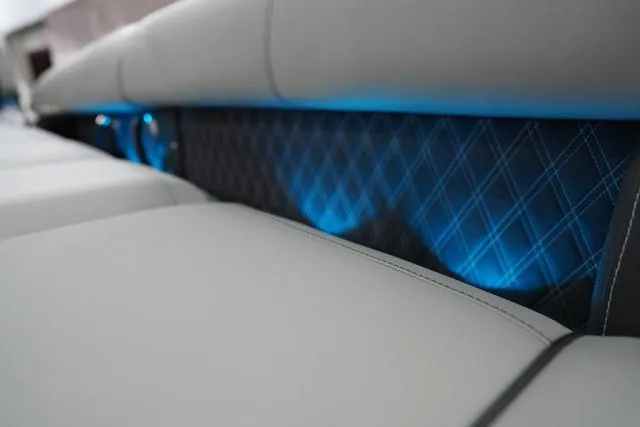 Slide: The Image of Luxurious seating with blue LED lighting on 2025 Barletta Boats L23M. - 33