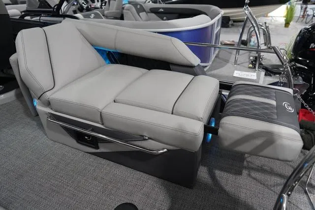 Slide: The Image of Luxurious seating on 2025 Barletta Boats L23M, featuring plush gray upholstery and modern design. - 34