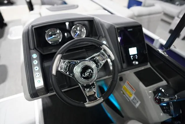 Slide: The Image of Steering console of 2025 Barletta Boats L23M with modern controls and gauges. - 6