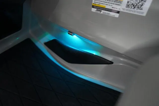 Slide: The Image of Interior lighting detail of 2025 Barletta Boats L23M, featuring ambient blue LED illumination. - 8