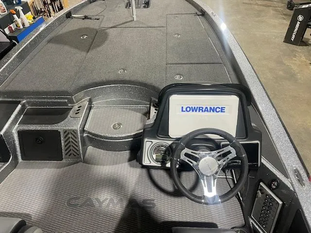 Slide: The Image of 2023 Caymas CX21Pro boat interior with Lowrance navigation system and steering wheel. - 7