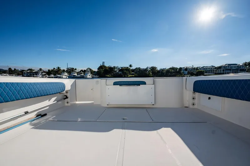 Slide: The Image of 2015 Stamas 390 Aegean boat deck with blue seating under clear sky. - 11