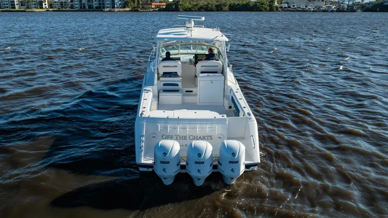 Slide: The Image of 2015 Stamas 390 Aegean boat with triple engines cruising on open water. - 12