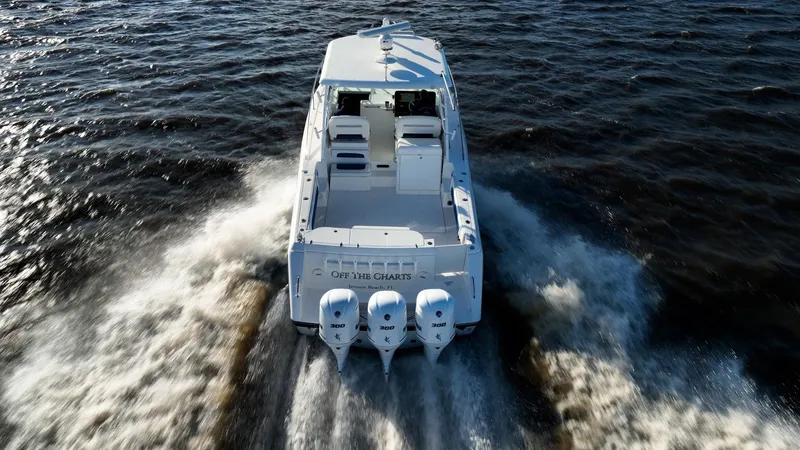 Slide: The Image of 2015 Stamas 390 Aegean boat cruising on open water, rear view. - 13