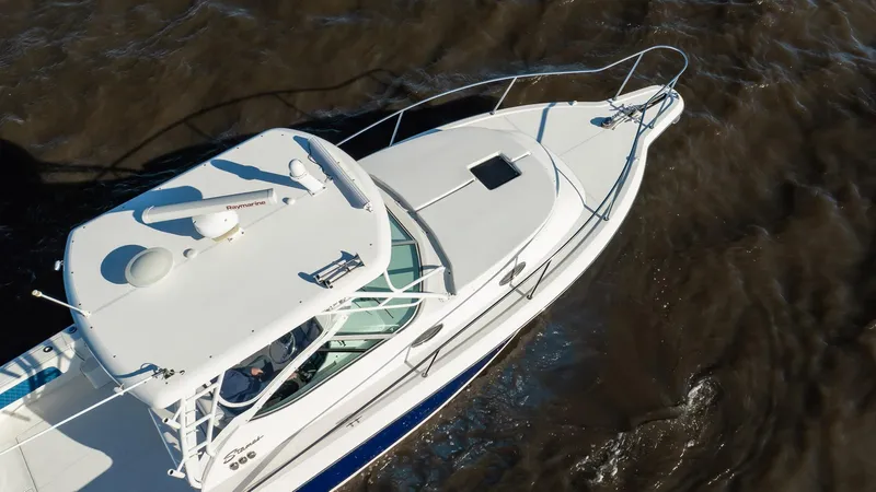 Slide: The Image of 2015 Stamas 390 Aegean boat cruising on dark water, aerial view. - 17