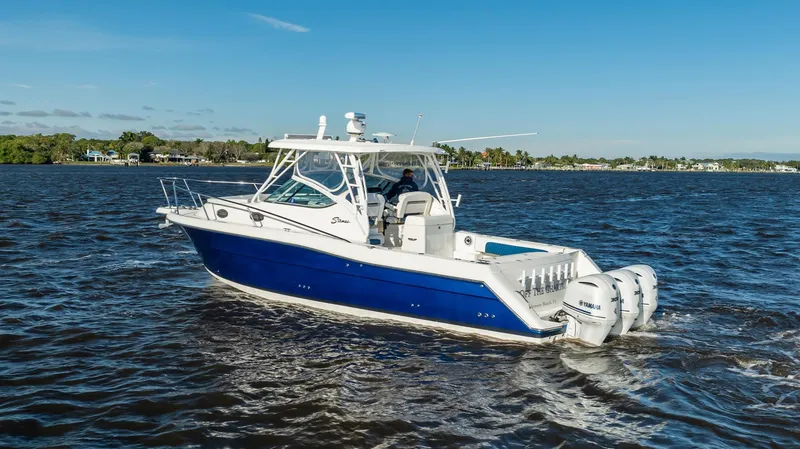 Slide: The Image of 2015 Stamas 390 Aegean boat cruising on open water under clear blue sky. - 2