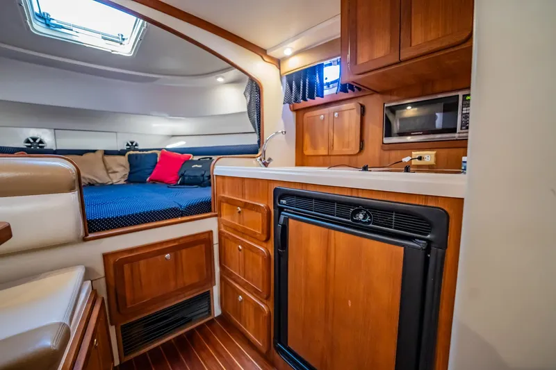 Slide: The Image of 2015 Stamas 390 Aegean cabin interior with kitchenette and cozy sleeping area. - 5