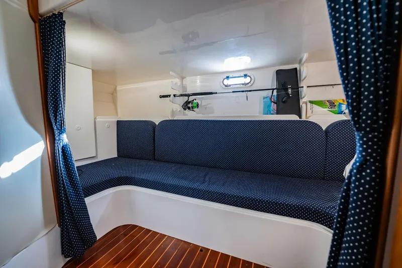 Slide: The Image of Interior cabin of 2015 Stamas 390 Aegean boat with blue seating and wooden floor. - 7