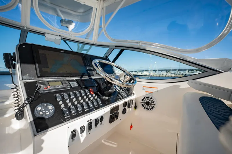 Slide: The Image of 2015 Stamas 390 Aegean boat cockpit with steering wheel and control panel. - 9