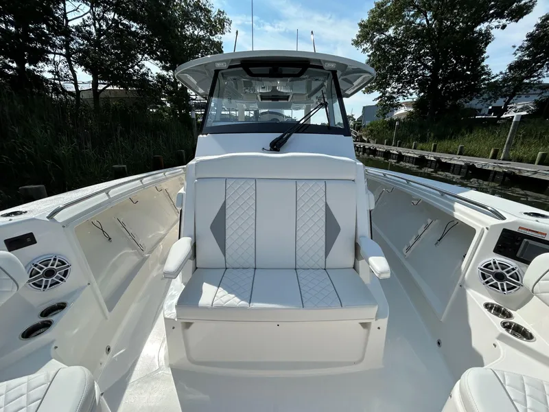 Slide: The Image of 2026 Pursuit S 358 boat interior with white seating and modern design. - 20